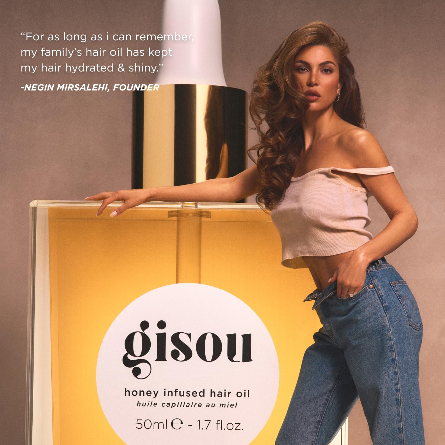 Gisou Honey Infused Hair Oil Mini amber bottle emphasizes premium care.
