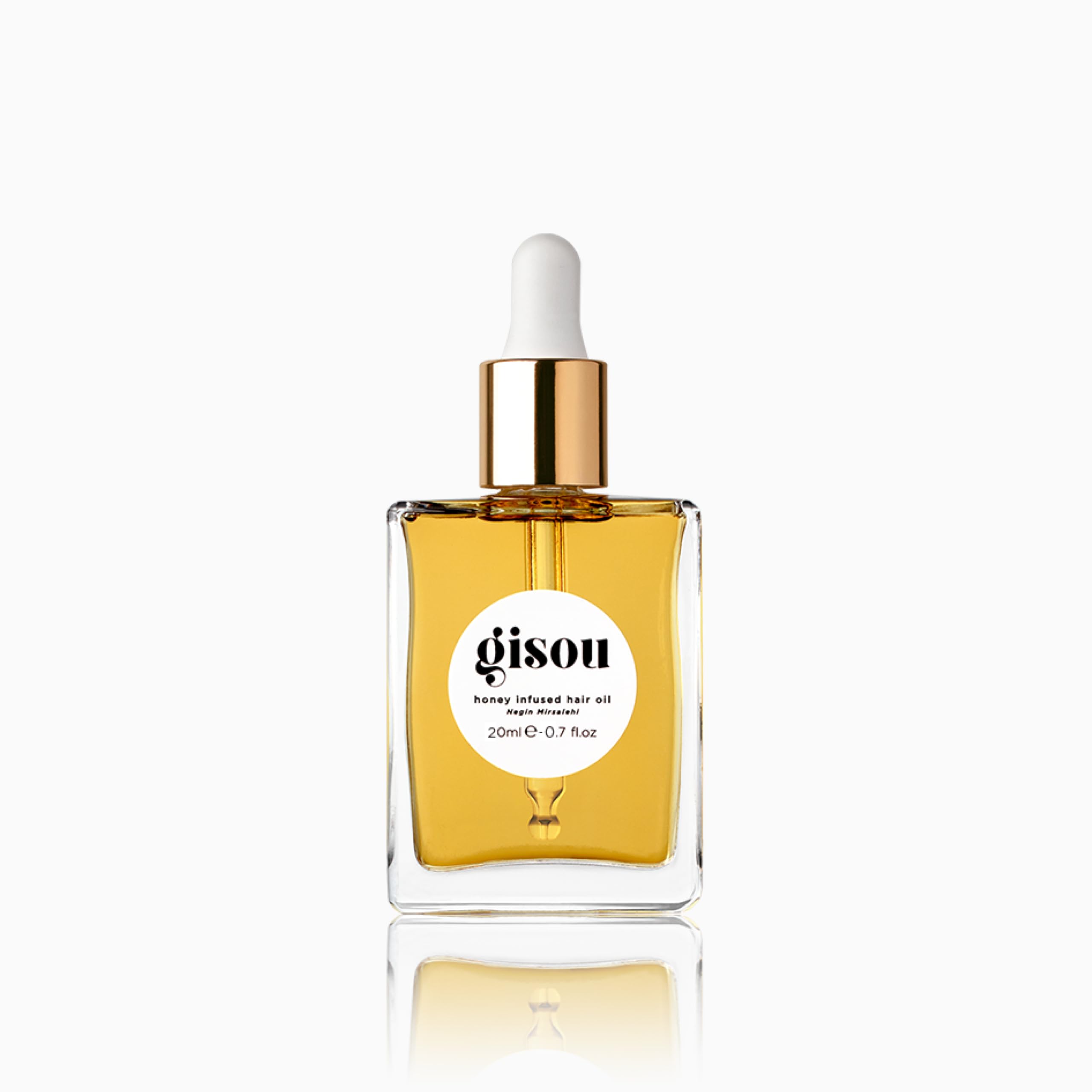Gisou Honey Infused Hair Oil Mini bottle close-up showing hydration-ready shine.
