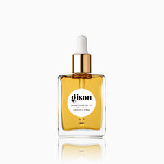 Gisou Honey Infused Hair Oil Mini bottle close-up showing hydration-ready shine.