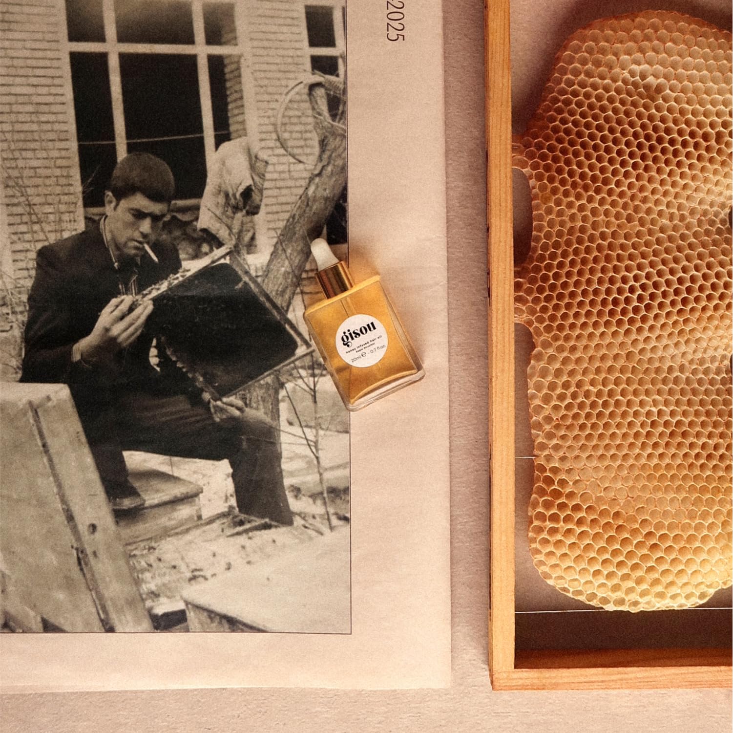 Gisou Honey Infused Hair Oil Mini vanity shot conveys luxury routine.