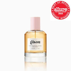 Gisou Honey Infused Hair Perfume spray on mid-lengths for subtle moisture.