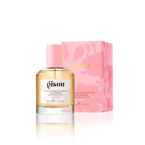 Close-up of Gisou Wild Rose sprayer delivering long-lasting fragrance.
