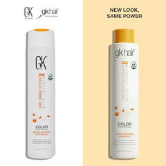 Close-up of GK Hair Moisturizing Shampoo lather in hand.