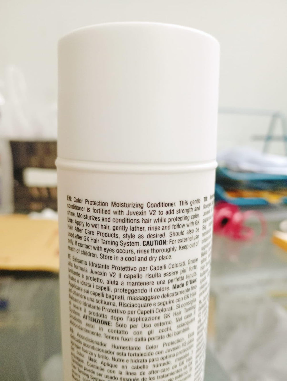 Sulfate-free GK Hair Moisturizing Shampoo label on bottle.