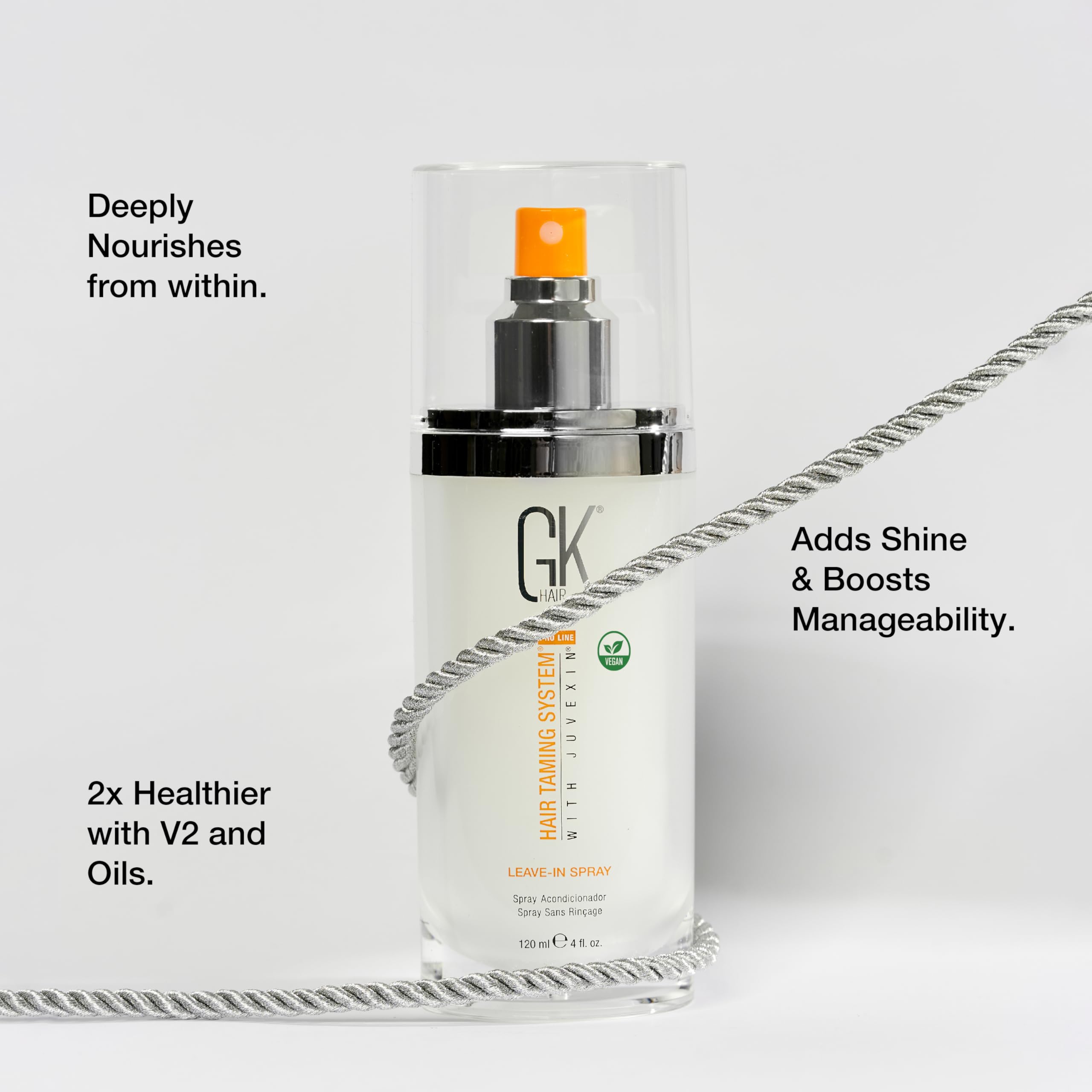 GK Hair vegan leave-in conditioner spray applying instant moisture to hair