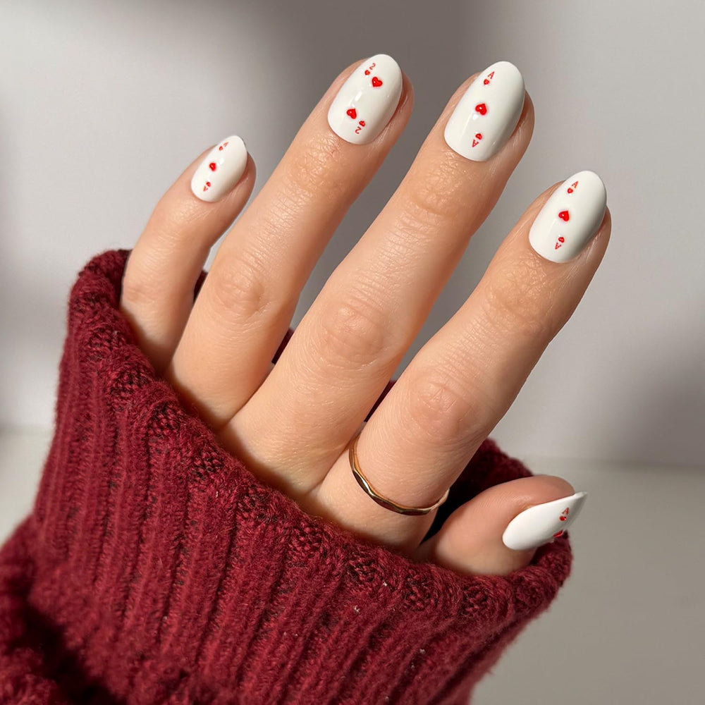 Glamnetic Ace of Hearts nails with white base and raised graphics for a bold mani.