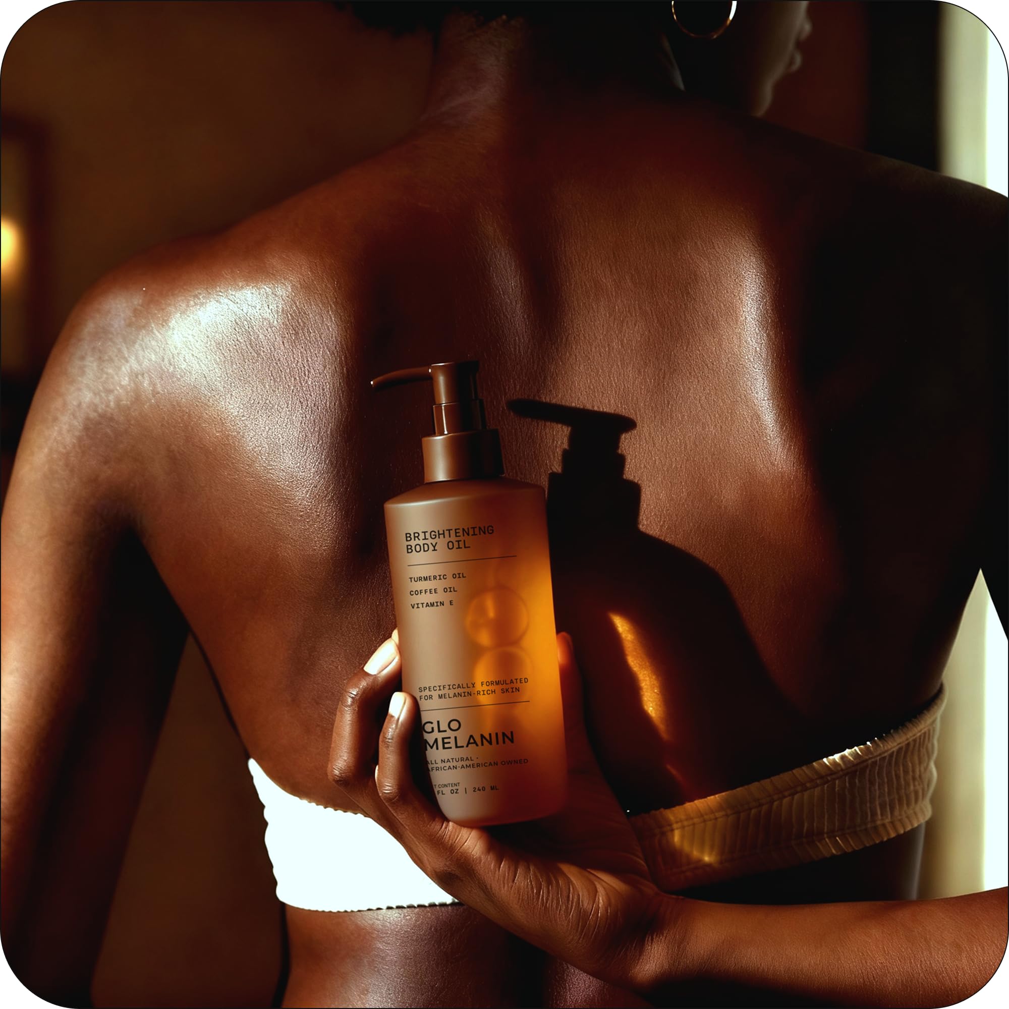 Glo Melanin Brightening Body Oil ingredients label highlights vitamin C and turmeric.