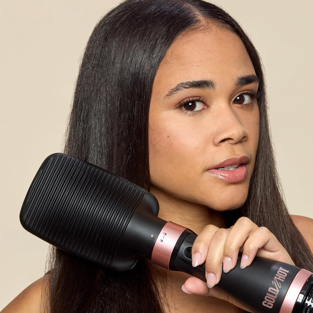 Gold N Hot Ionic Dryer and Styler soft bristles smoothing strands during styling.
