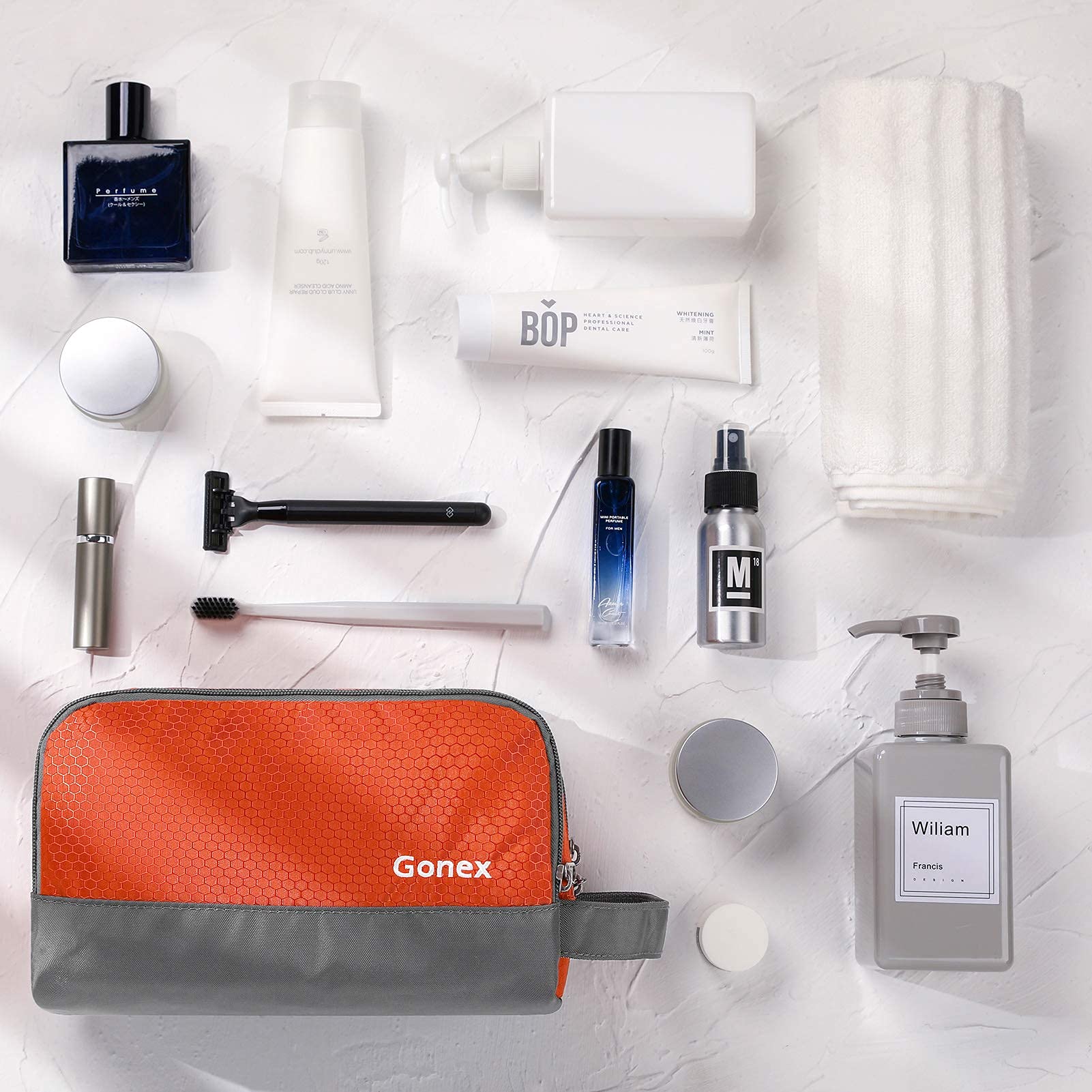 Gonex toiletry bag in use on a hotel shelf showing capacity.