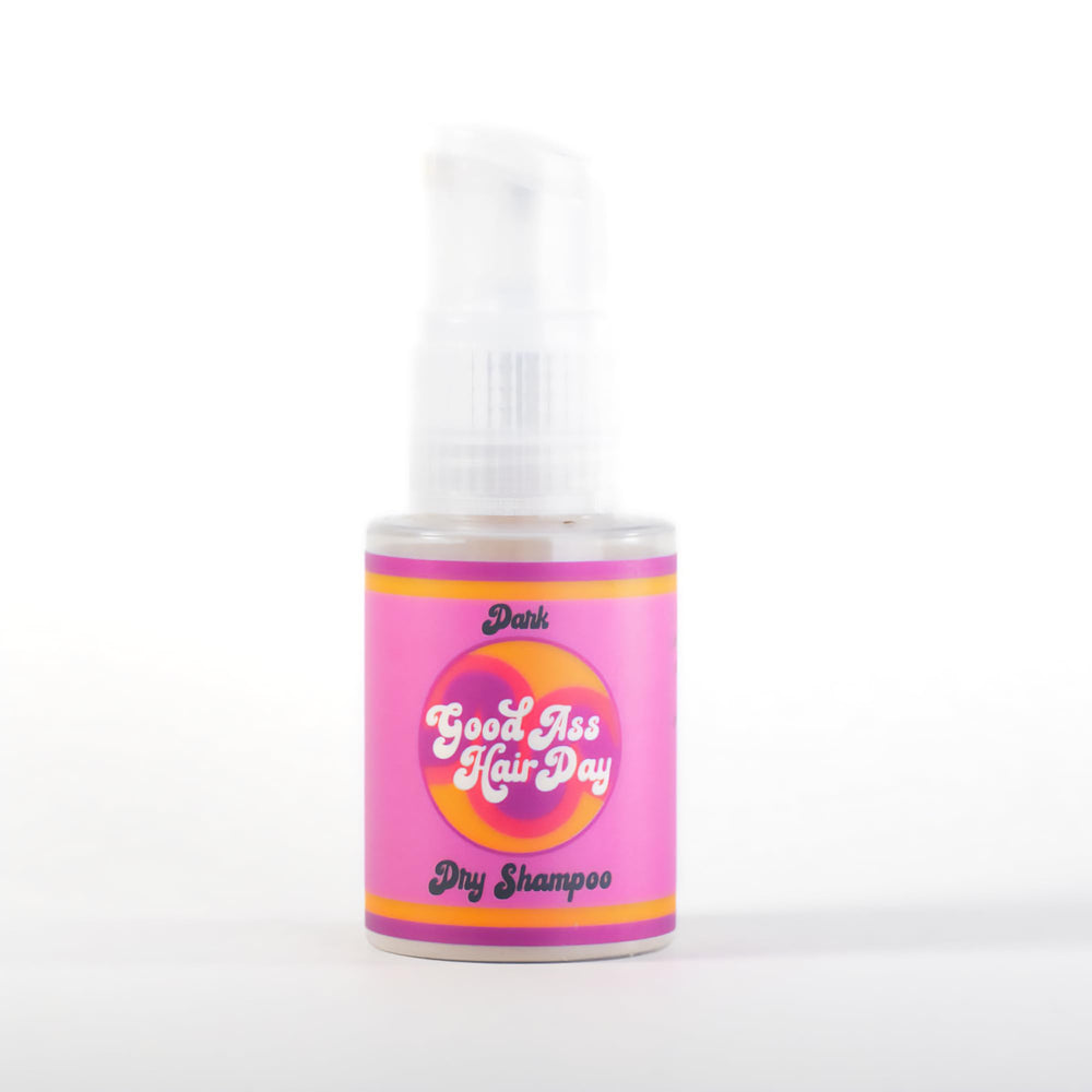 Good Ass Hair Day dark dry shampoo powder refreshes oily roots with no white cast.