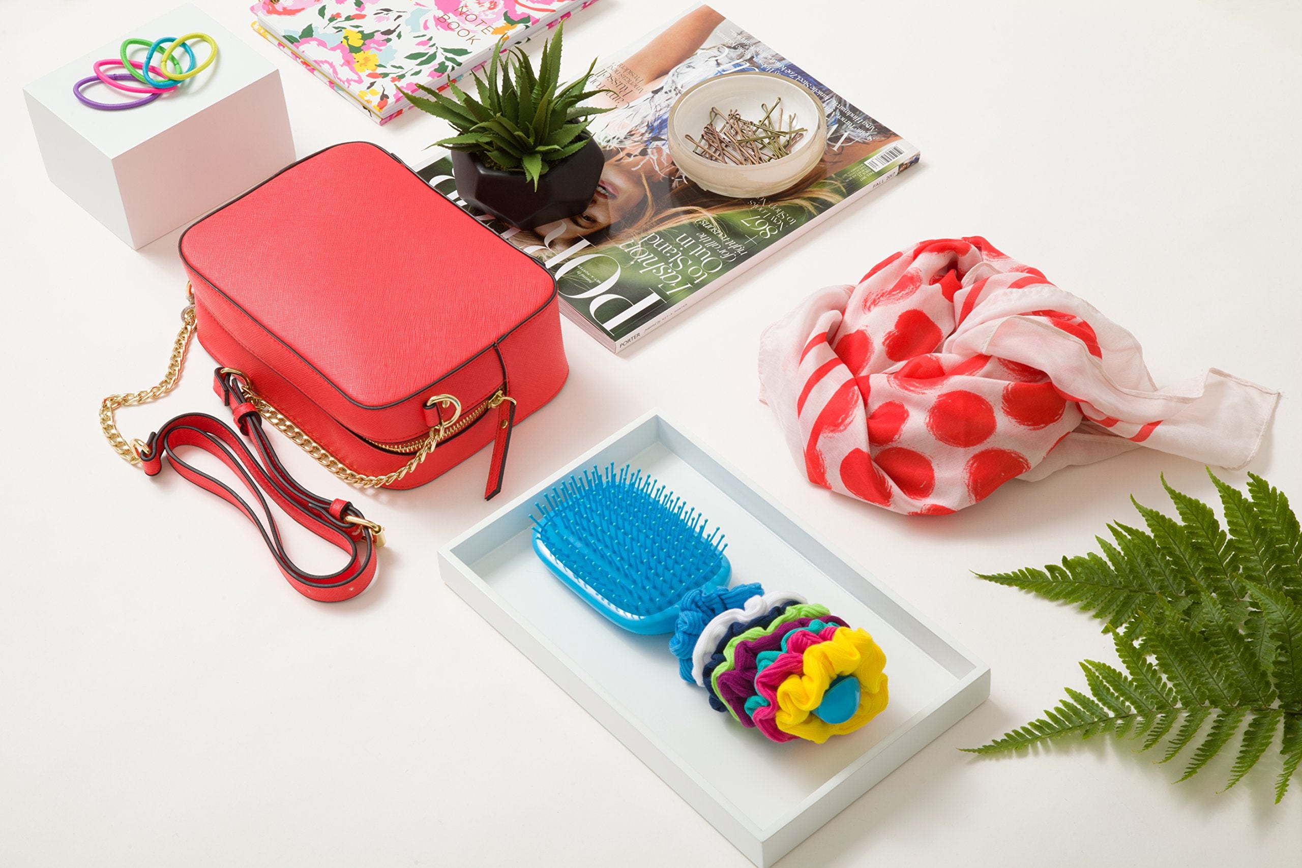 Assorted hues show versatile styling for all hair types with Goody scrunchies.