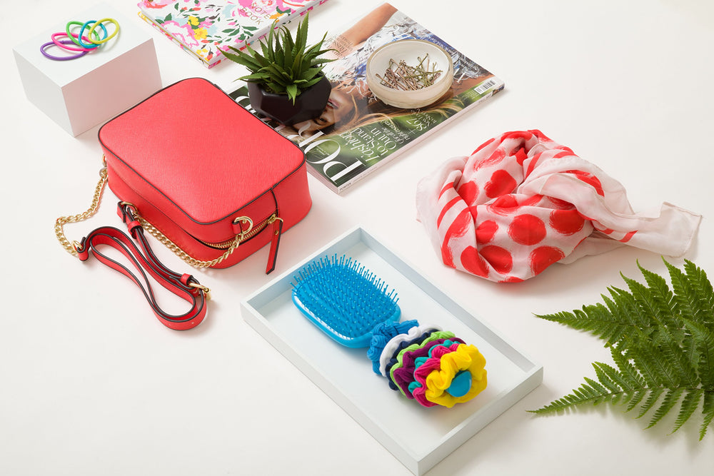 Assorted hues show versatile styling for all hair types with Goody scrunchies.