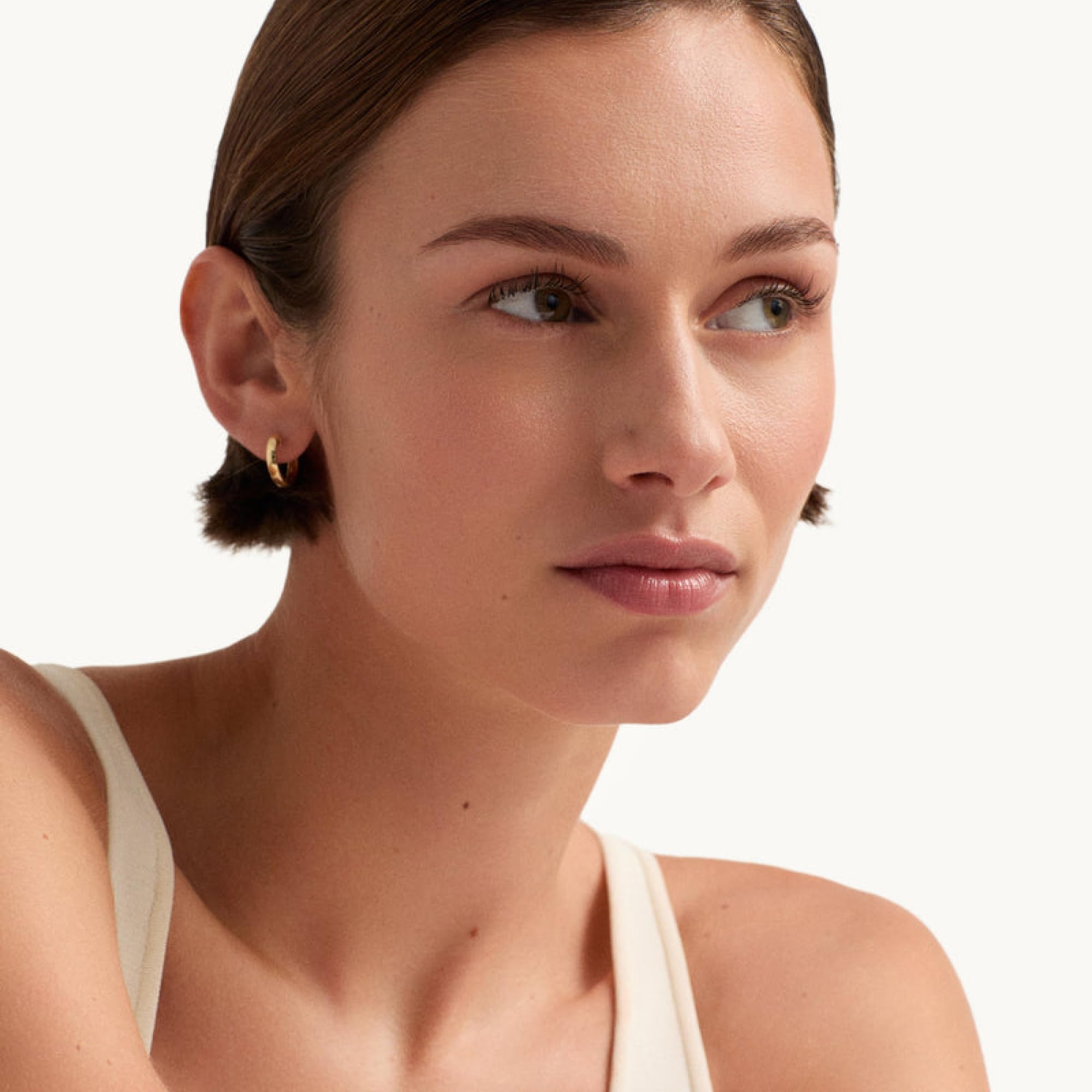 Close-up of Goop Nourishing Face Cream formula with ceramides and squalane on skin.
