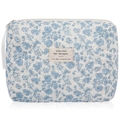 Gosect floral makeup bag closeup features blue floral print and sturdy stitching.