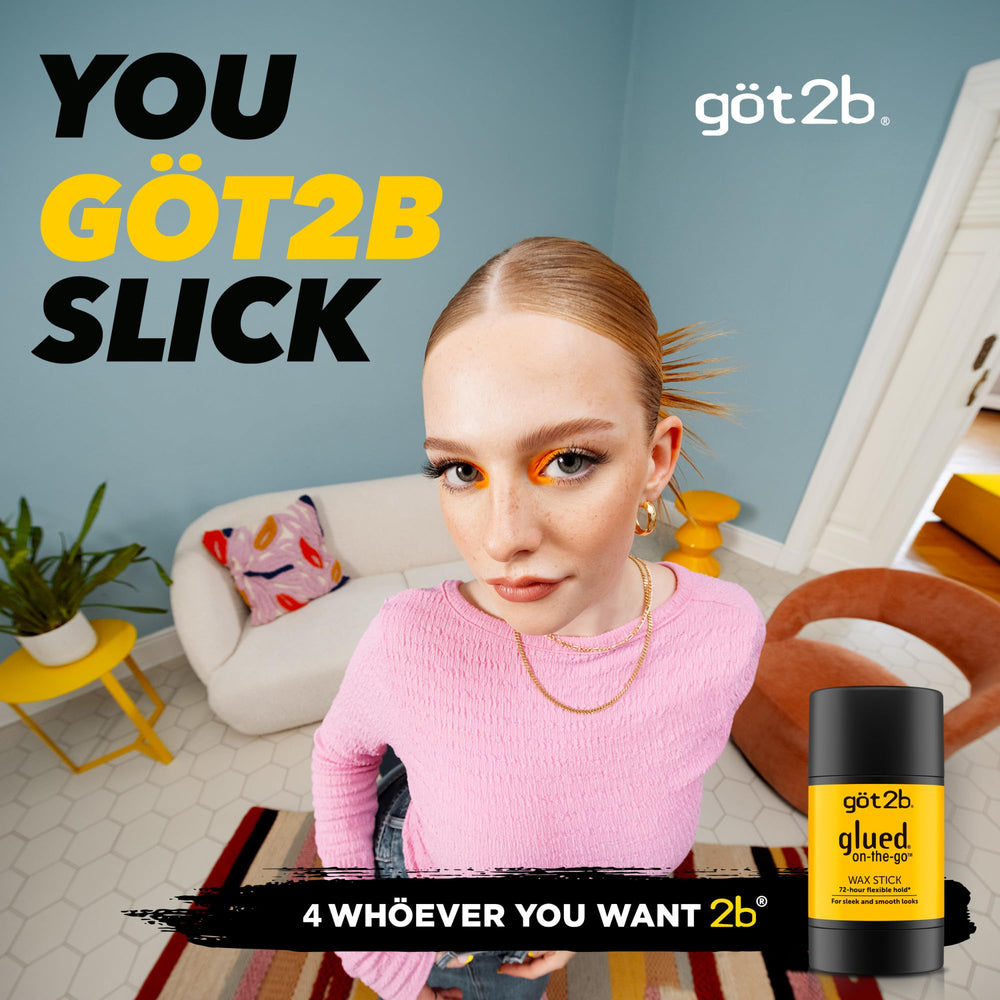 Got2b glued on-the-go wax stick being applied to hair for sleek, flexible hold.
