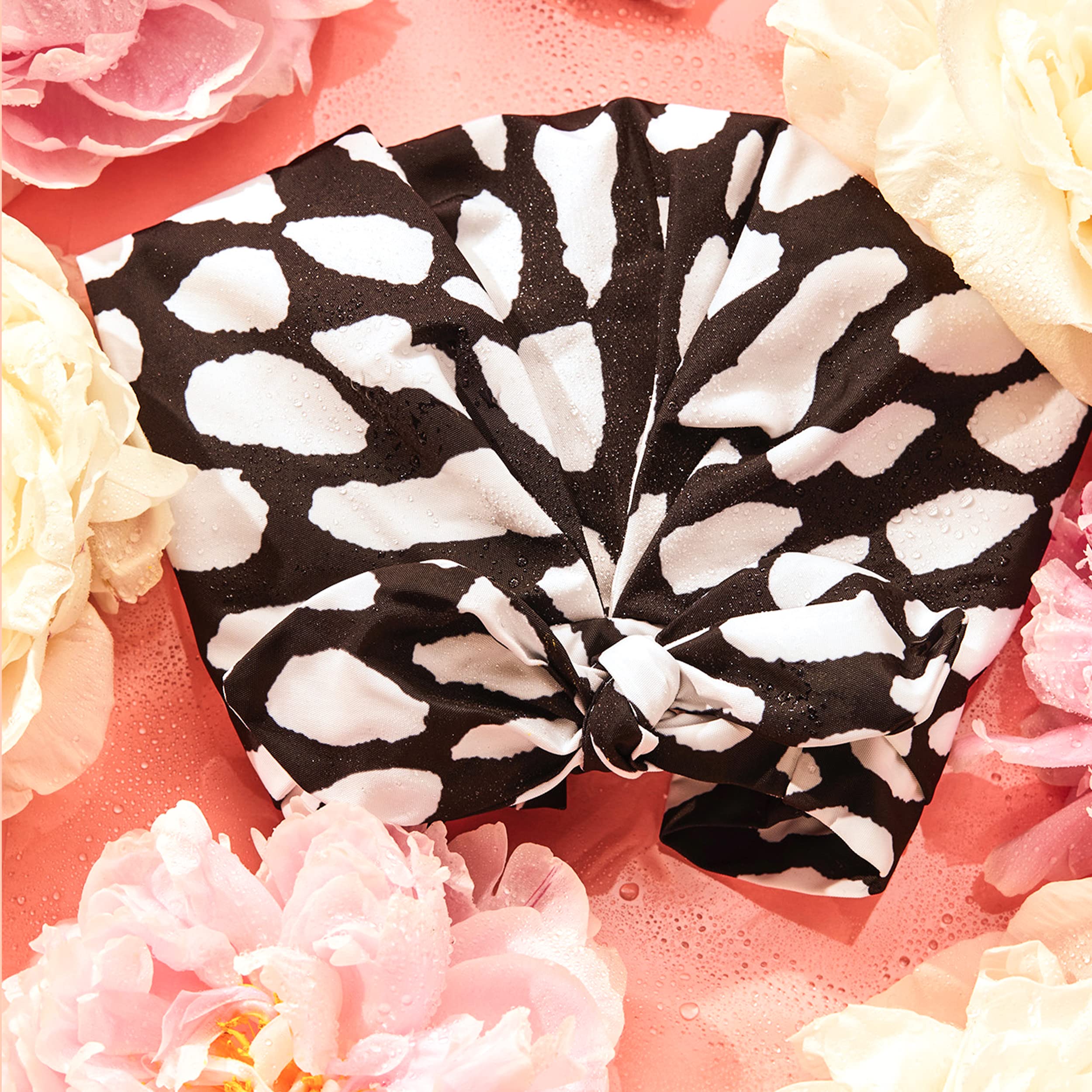 Grace & Company waterproof cap blocks humidity for lasting blowouts.