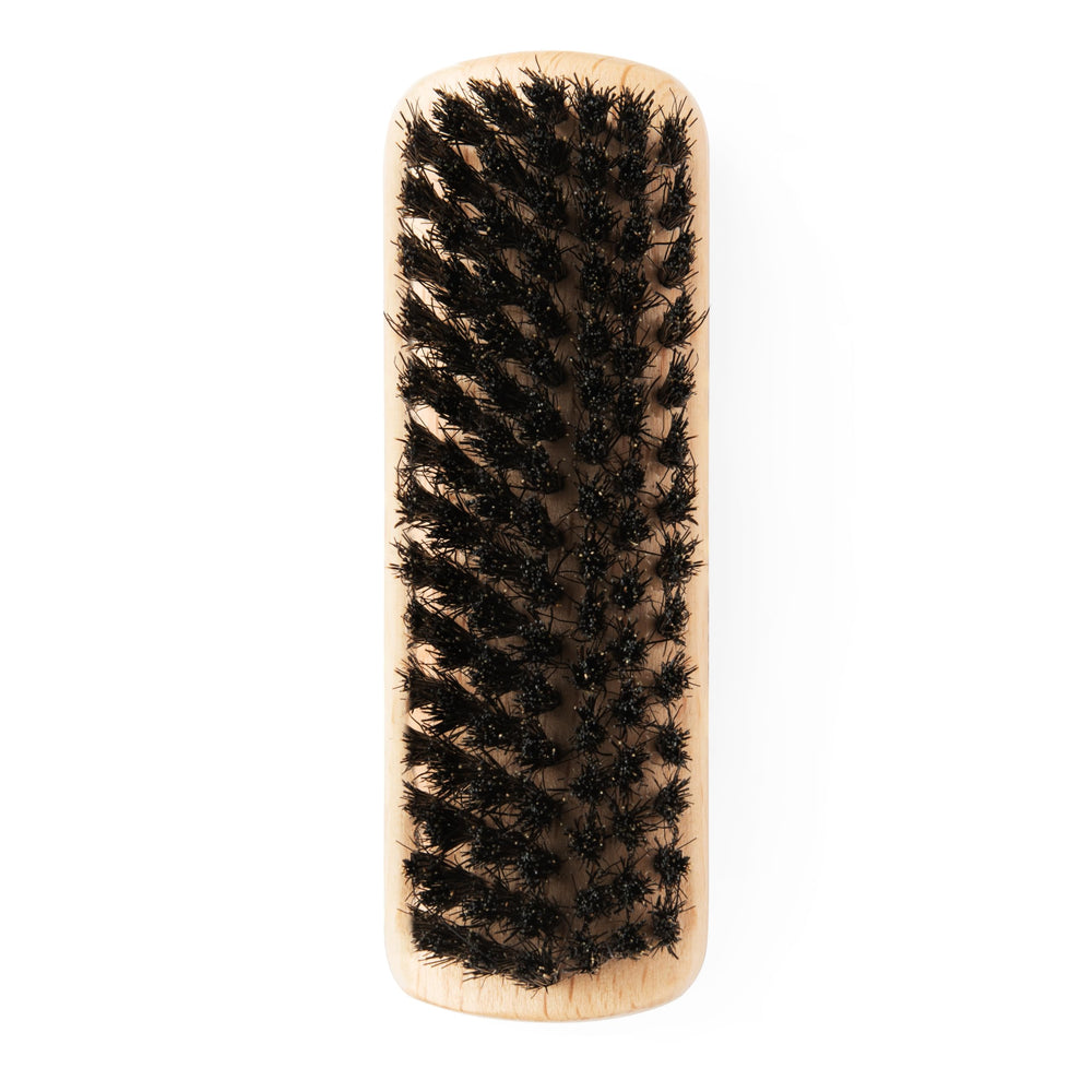 GranNaturals compact palm-size brush travels easily for on-the-go grooming.