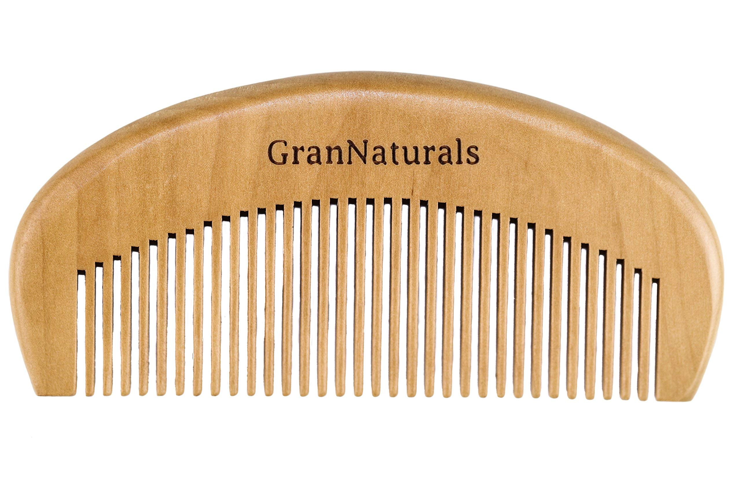 GranNaturals wooden comb close-up, teeth for gentle detangling and reduced frizz.