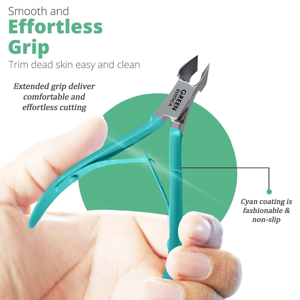 Green Estetica cuticle trimmer in hand showing ergonomic grip.