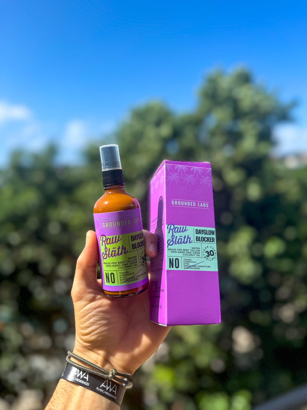 Grounded Labs sunblock on textured surface shows long-lasting, chemical-free coverage.