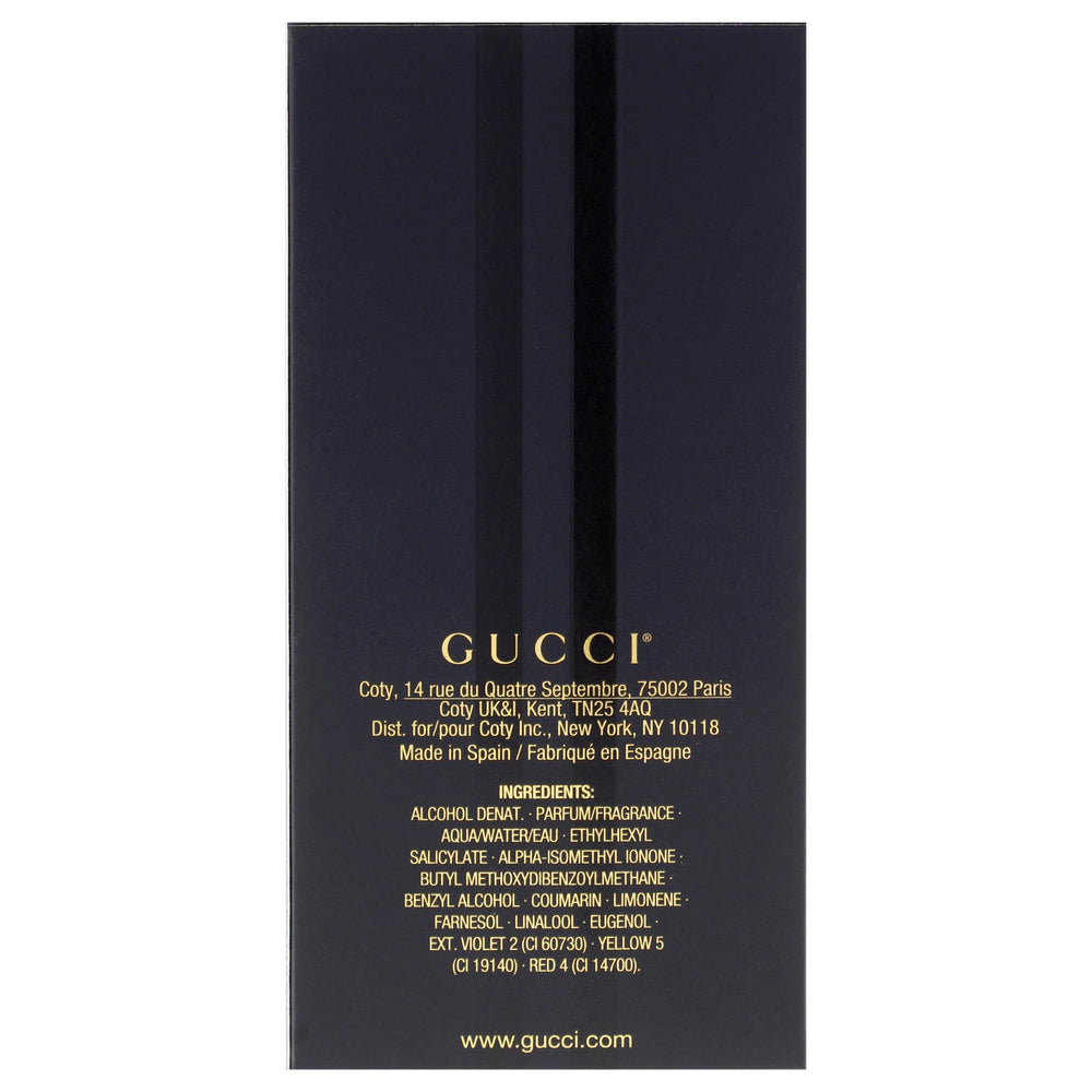 Gucci Intense Oud on a dresser setup ready for nighttime wear.