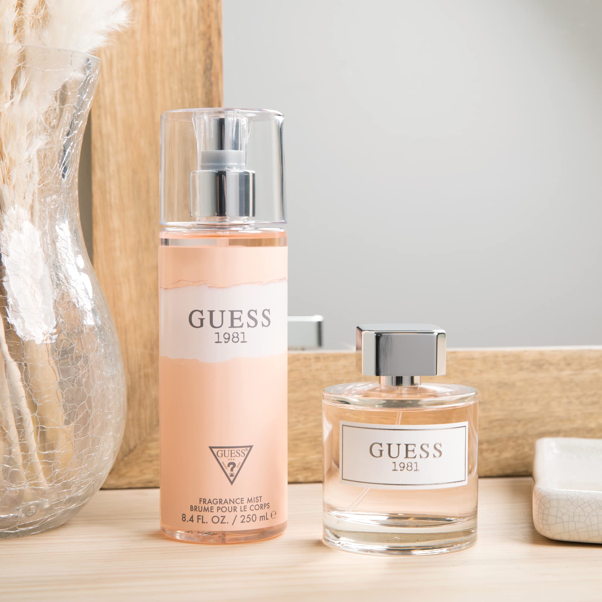 GUESS 1981 bottle on a reflective surface, adds luxury.