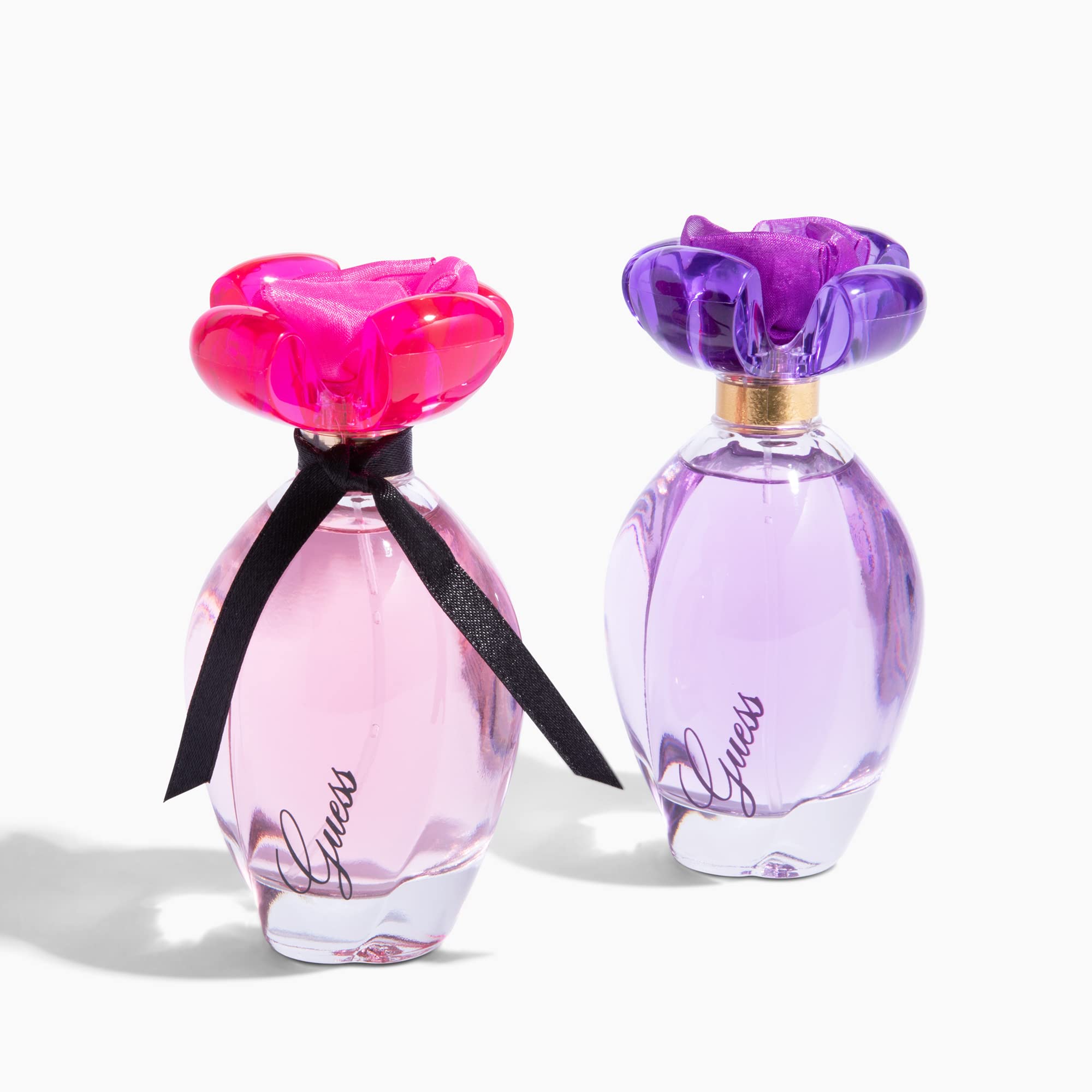 GUESS Girl EDT swatch near bottle to show color and scent theme
