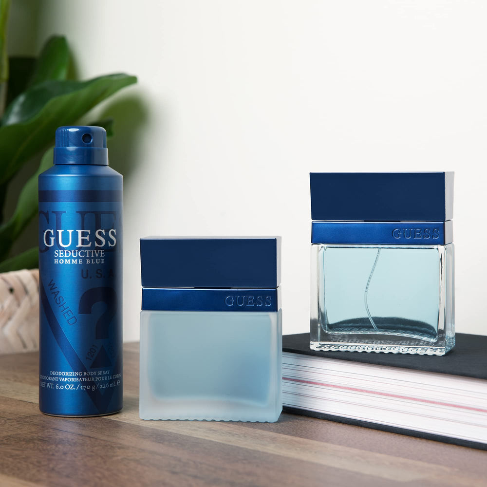 GUESS Seductive Homme Blue spray action showing fast-drying mist for quick refresh.