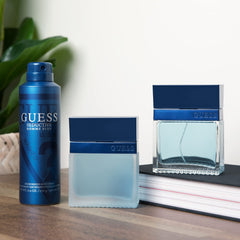 GUESS Seductive Homme Blue spray action showing fast-drying mist for quick refresh.