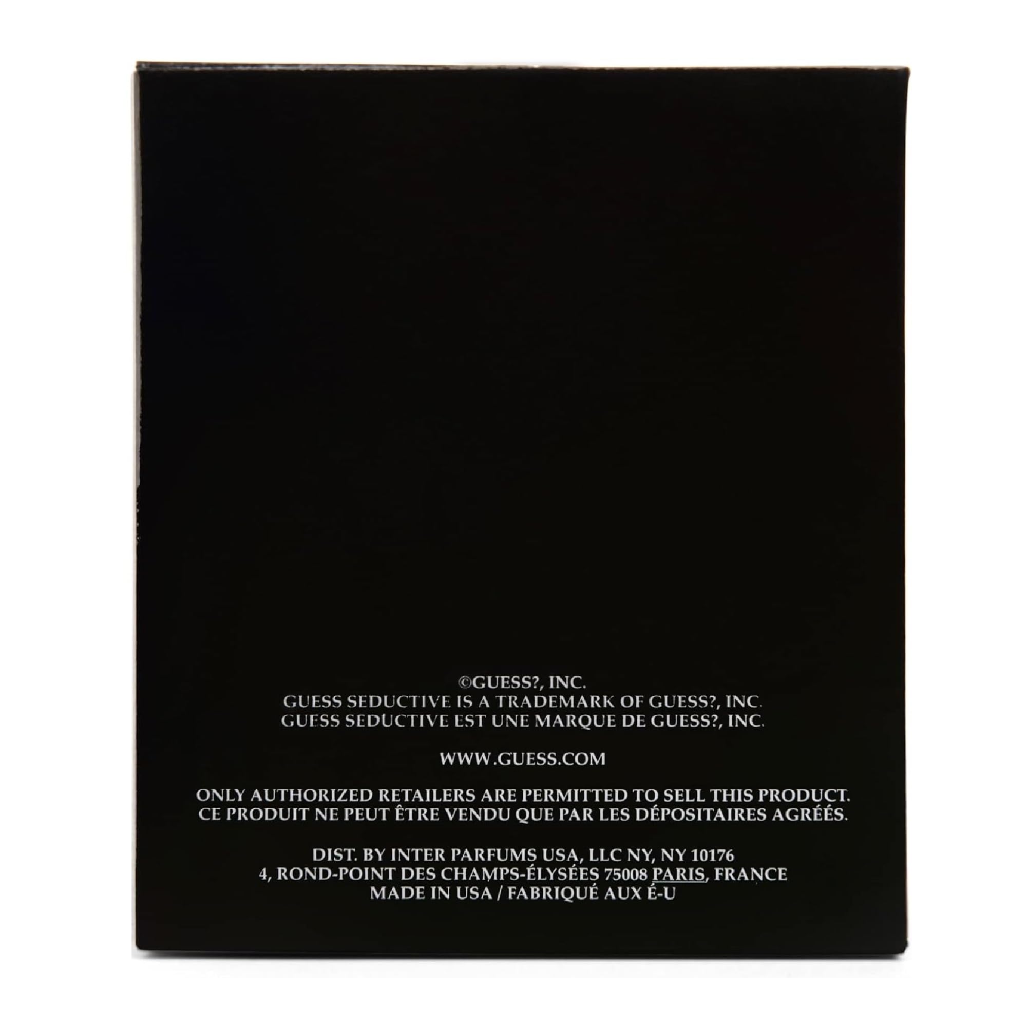 Beneath lighting GUESS Seductive Noir bottle reveals warm amber notes