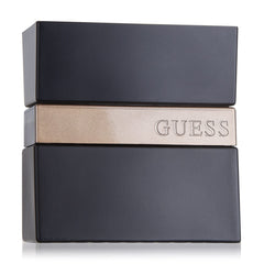 GUESS Seductive Noir spray mist captured mid-application moment