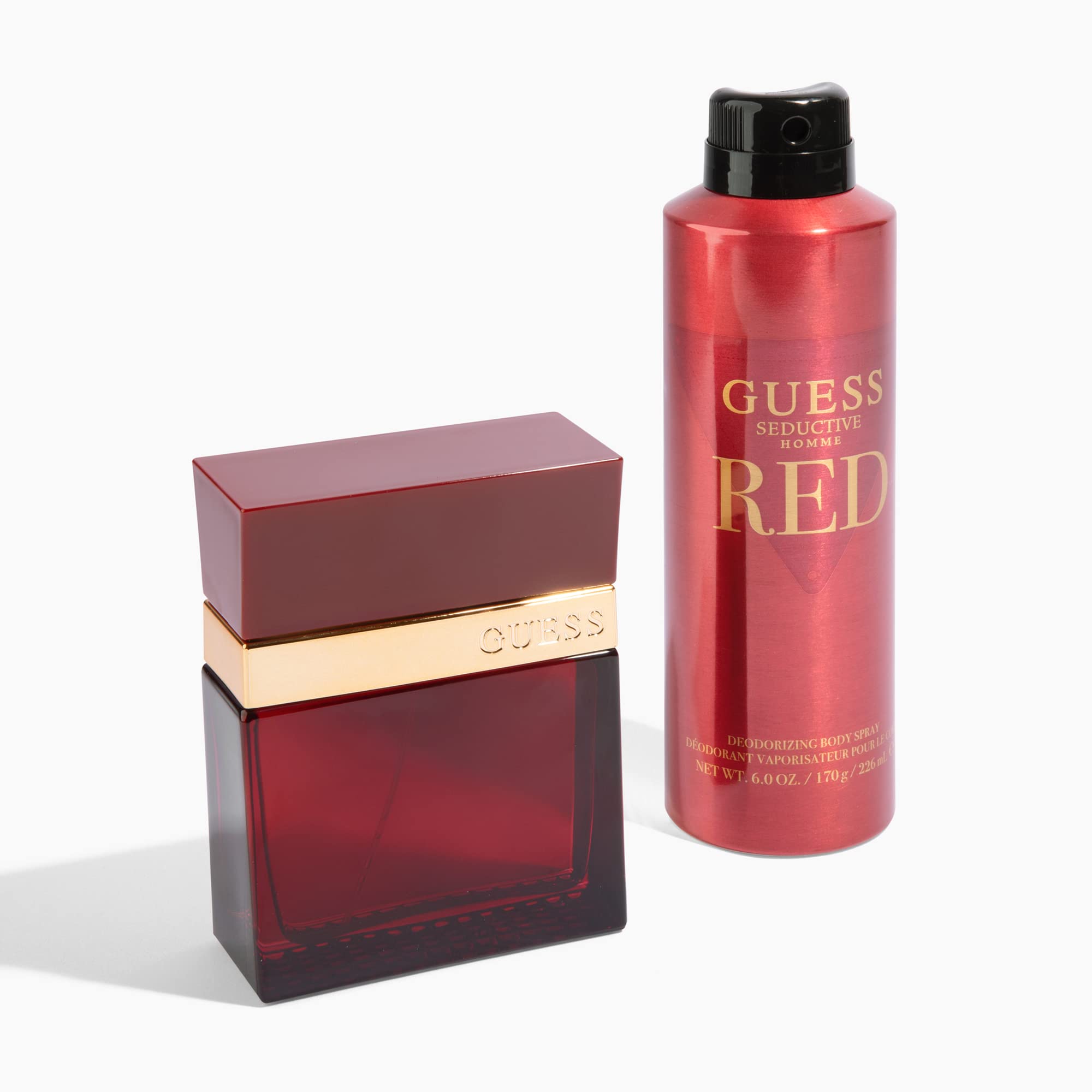 Advertising image of GUESS Seductive Red for men in a masculine setting.