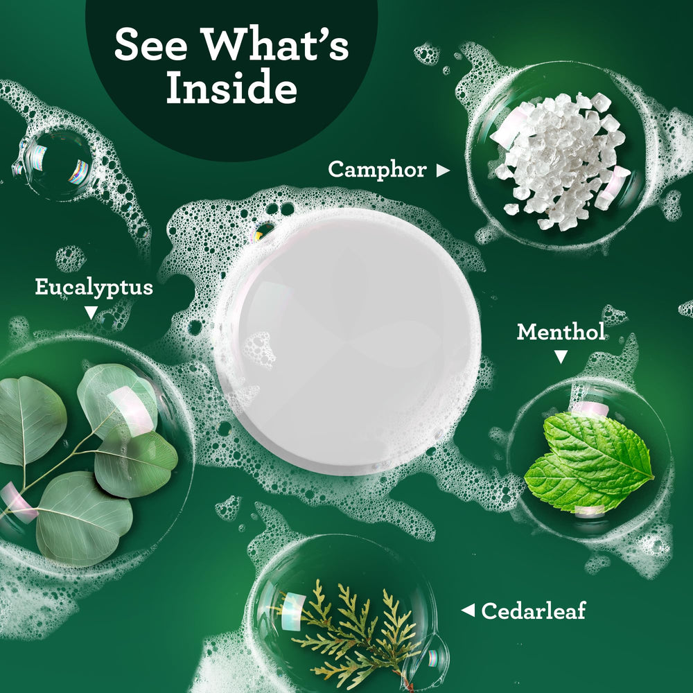 Tablet dissolving in warm shower water, releasing calming eucalyptus aroma.