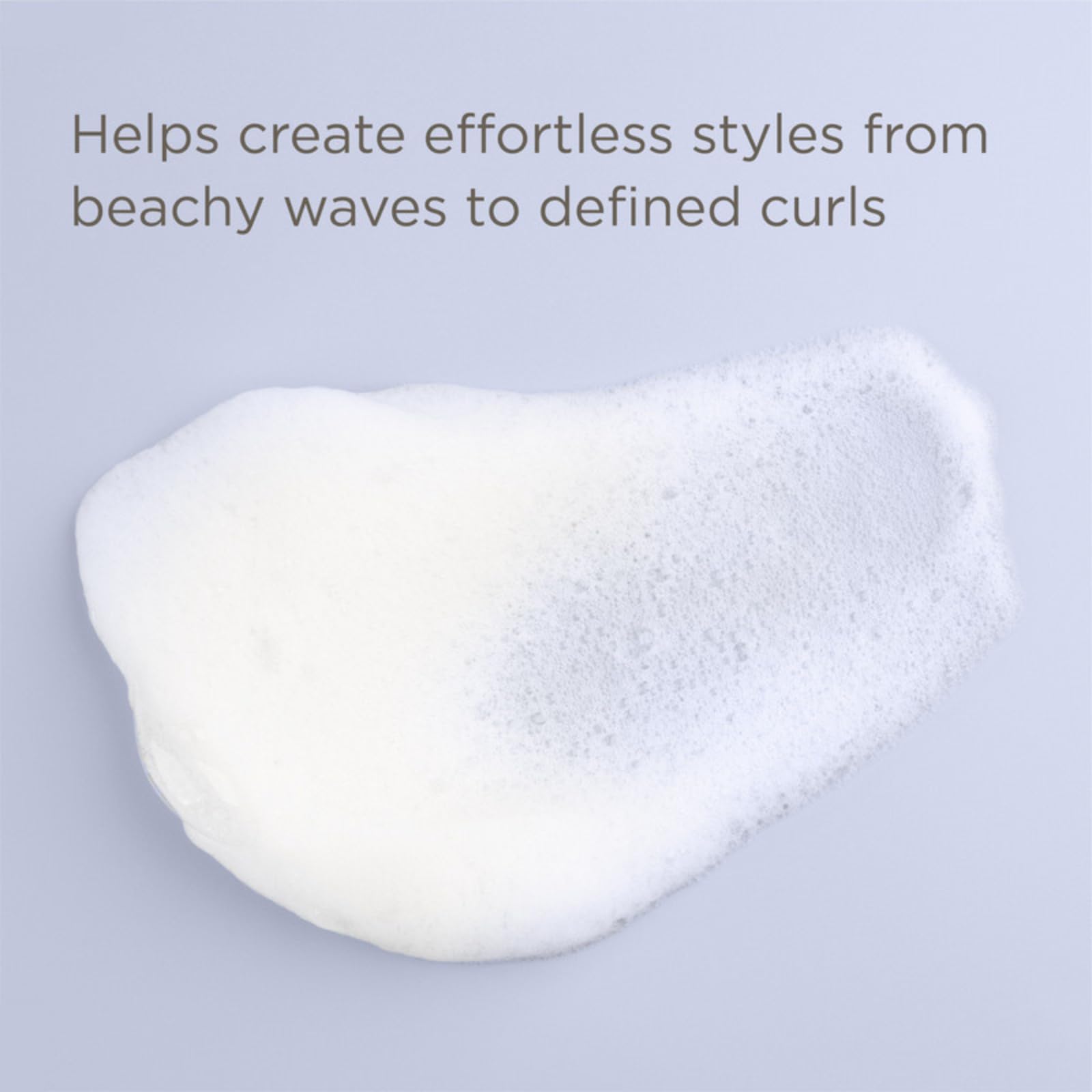 Hairitage Have It All mousse foam closeup highlights airy texture for smoother styling.