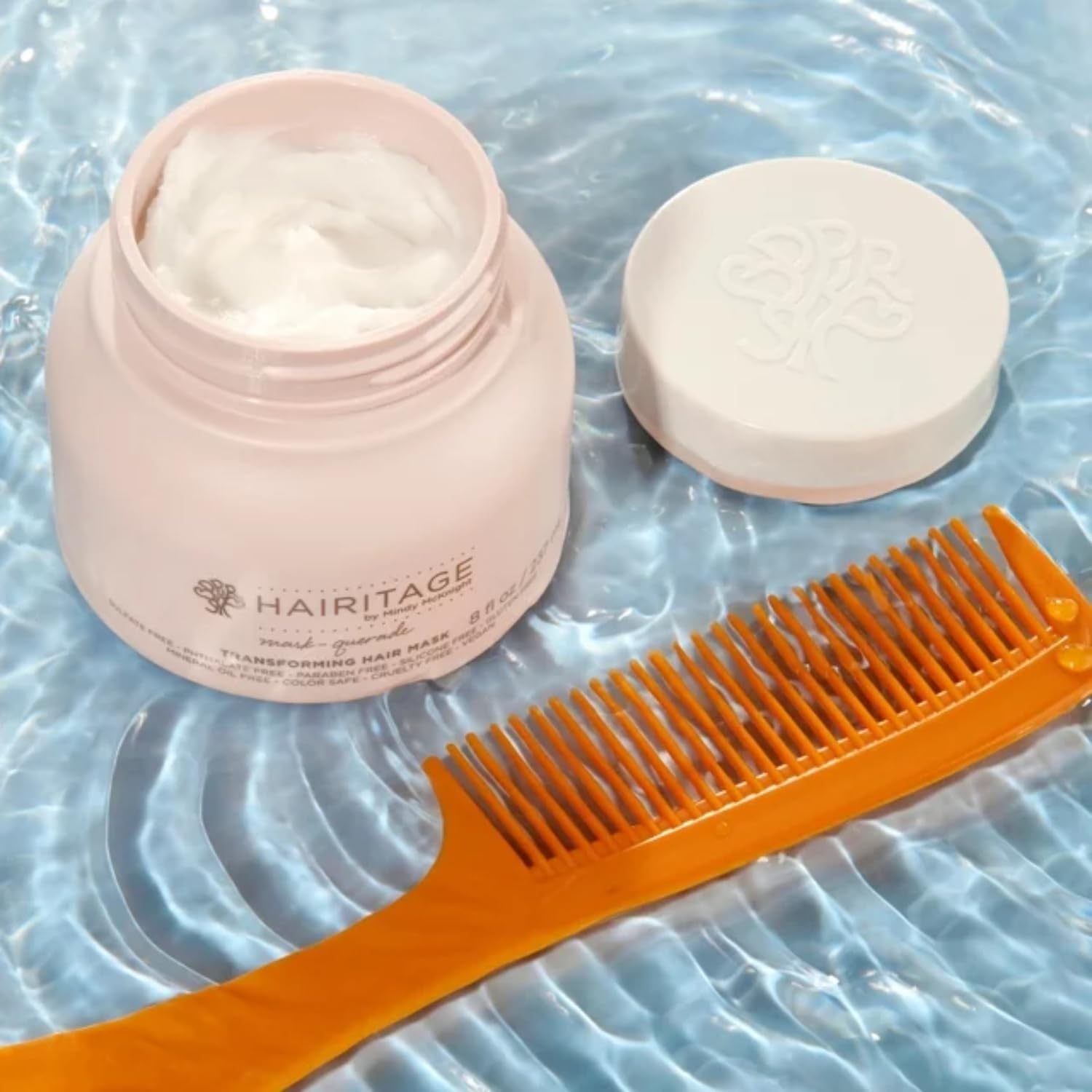 Aplicación suave en la ducha de Hairitage Argan para cuidado rápido.