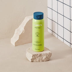 Close-up of creamy foam from Harry's Grove body wash for thorough cleansing.