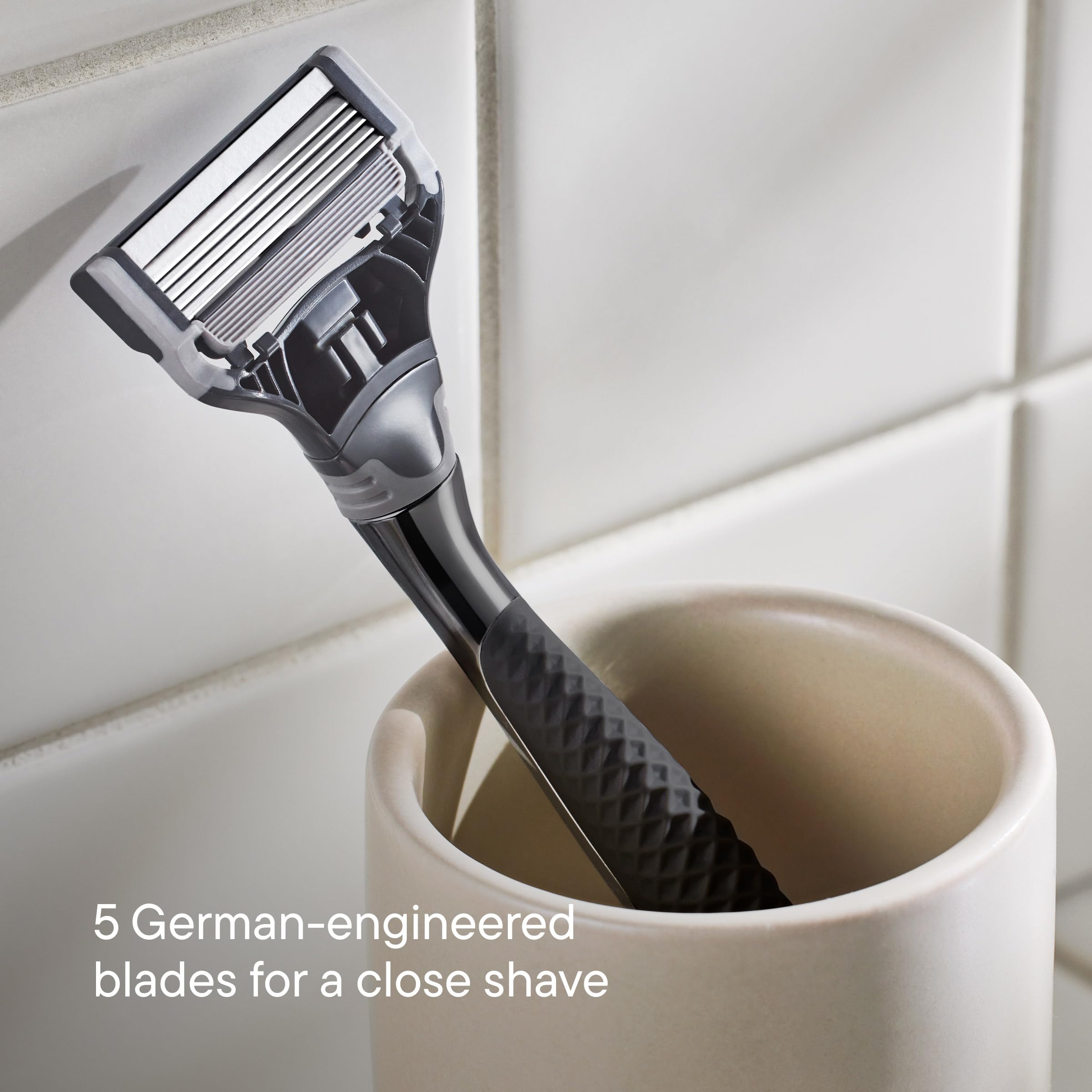 Truman handle close-up highlighting ergonomic grip for a steady shave.