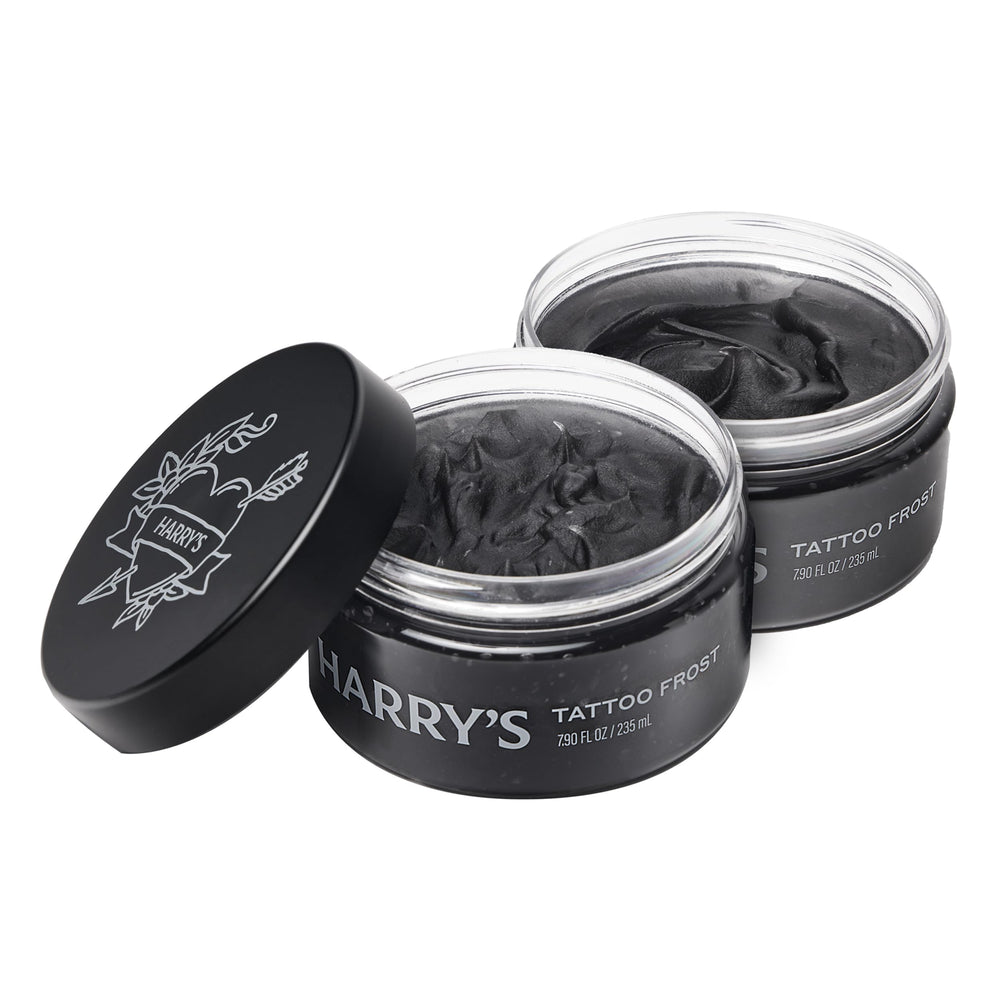 Harry’s Tattoo Frost bottle demonstrates lightweight hydration for vibrant tattoos.