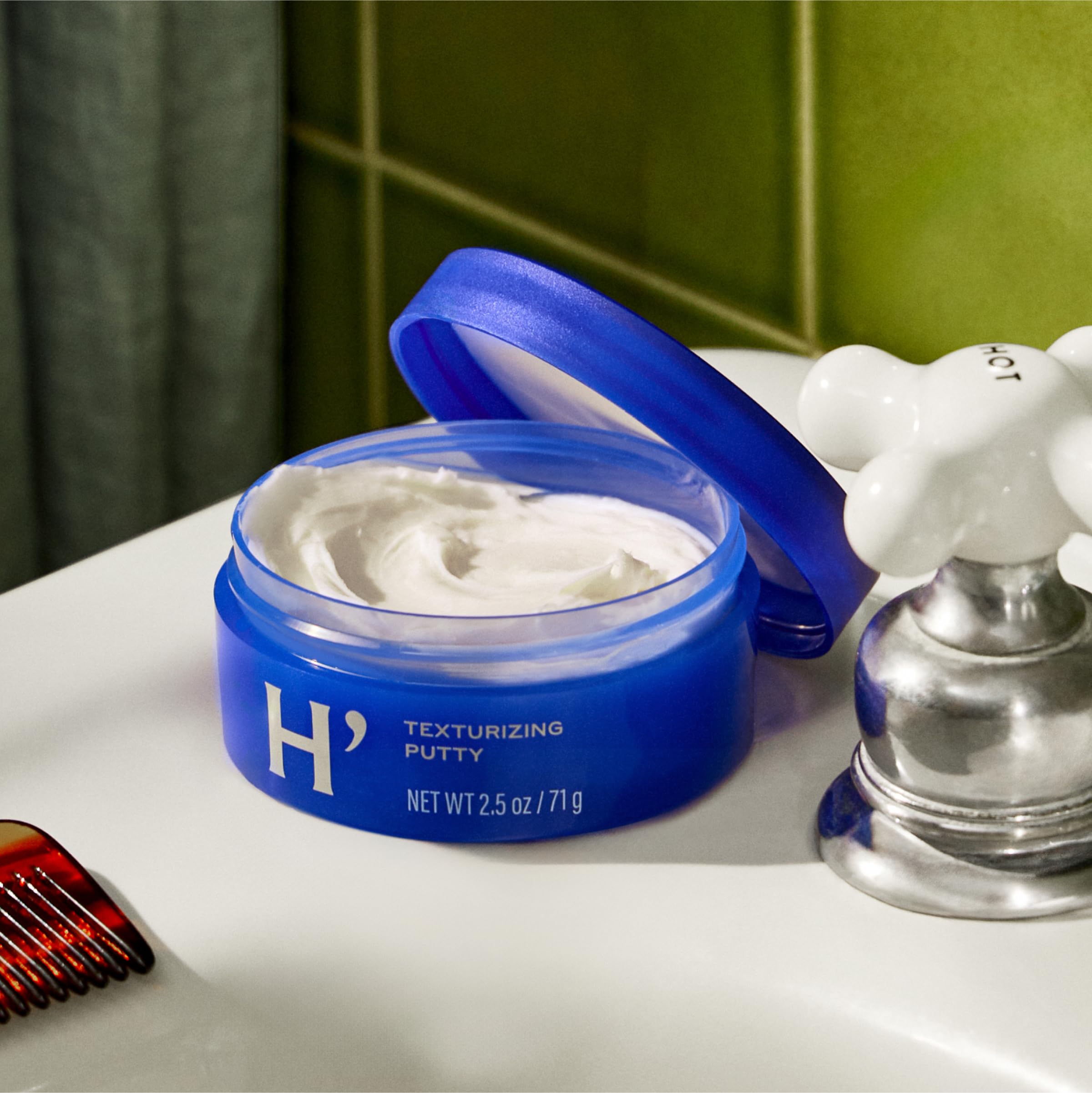 Harry's Texturizing Putty applied to dry hair for subtle texture and definition.