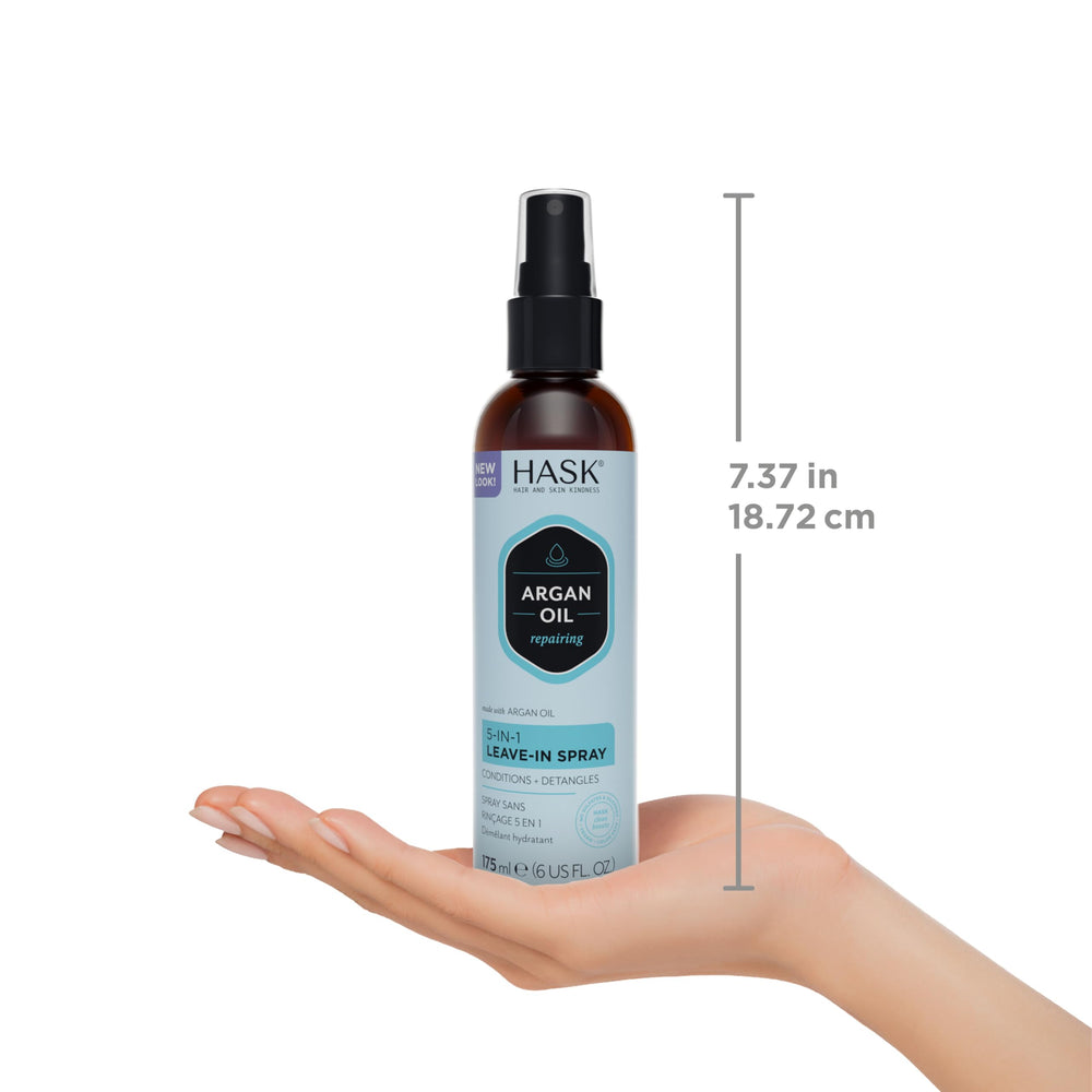 HASK Argan Oil spray being applied to damp hair to reduce frizz.