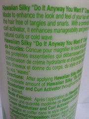 Hawaiian Silky cream moisturizer application demonstrates easy distribution for hydrated hair.