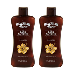 Hawaiian Tropic dark tanning oil bottle with cocoa butter for moisturized, radiant skin.