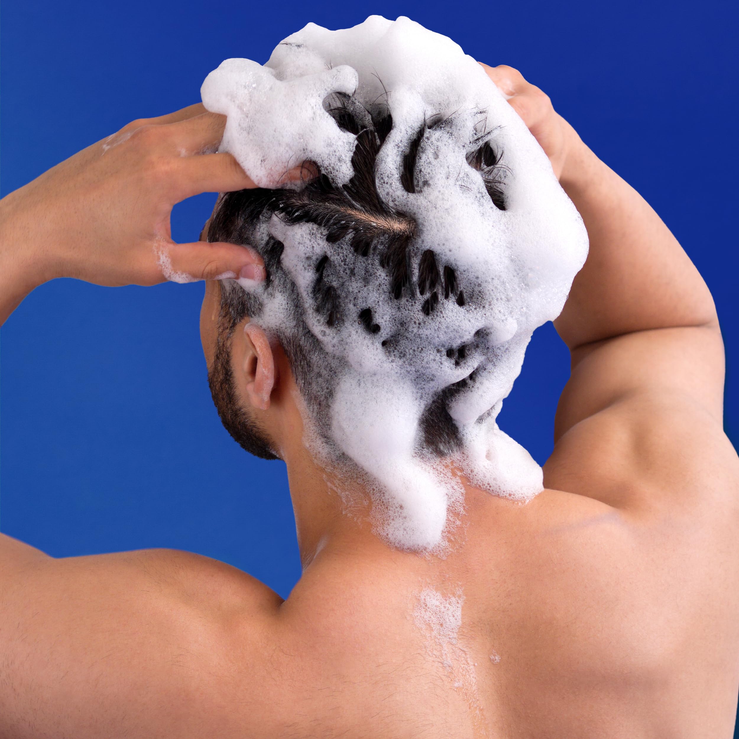 Head & Shoulders conditioner bottle highlighting hair smoothing benefits
