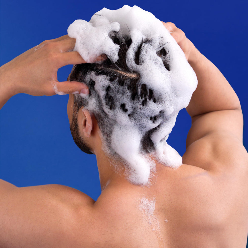 Head & Shoulders conditioner bottle highlighting hair smoothing benefits
