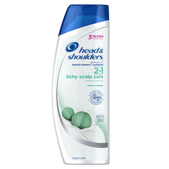 Head & Shoulders Itchy Scalp Care bottle pour with cooling relief and dandruff protection.