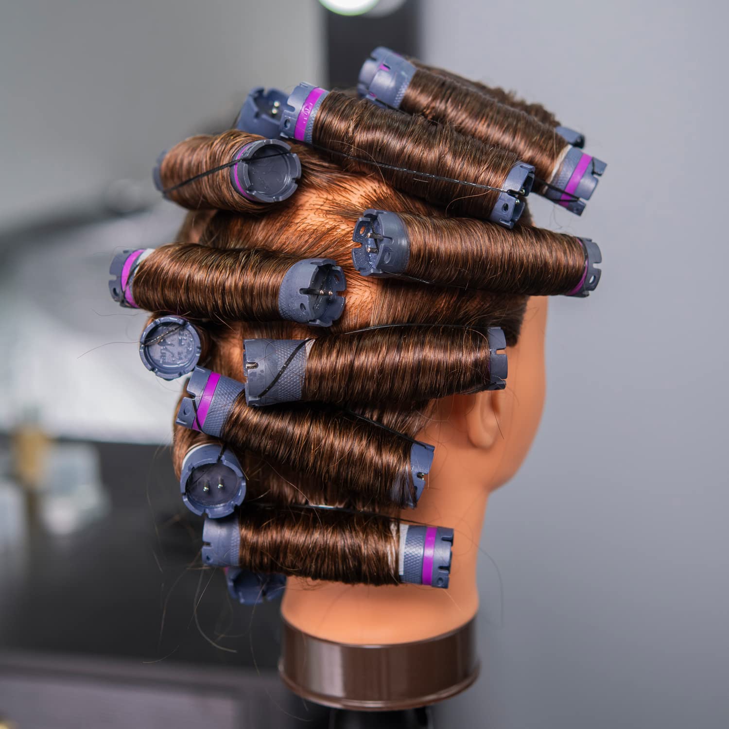 Headwinn traininghead close-up highlights 100% human hair quality and realism.