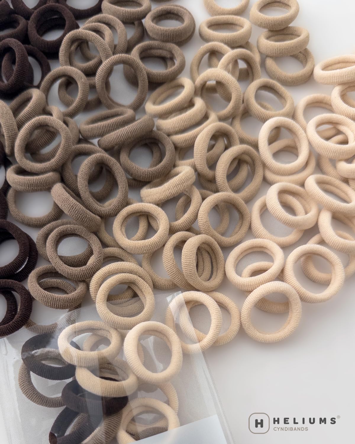 Heliums coleteros para trenzas negras, ajuste discreto y seguro.