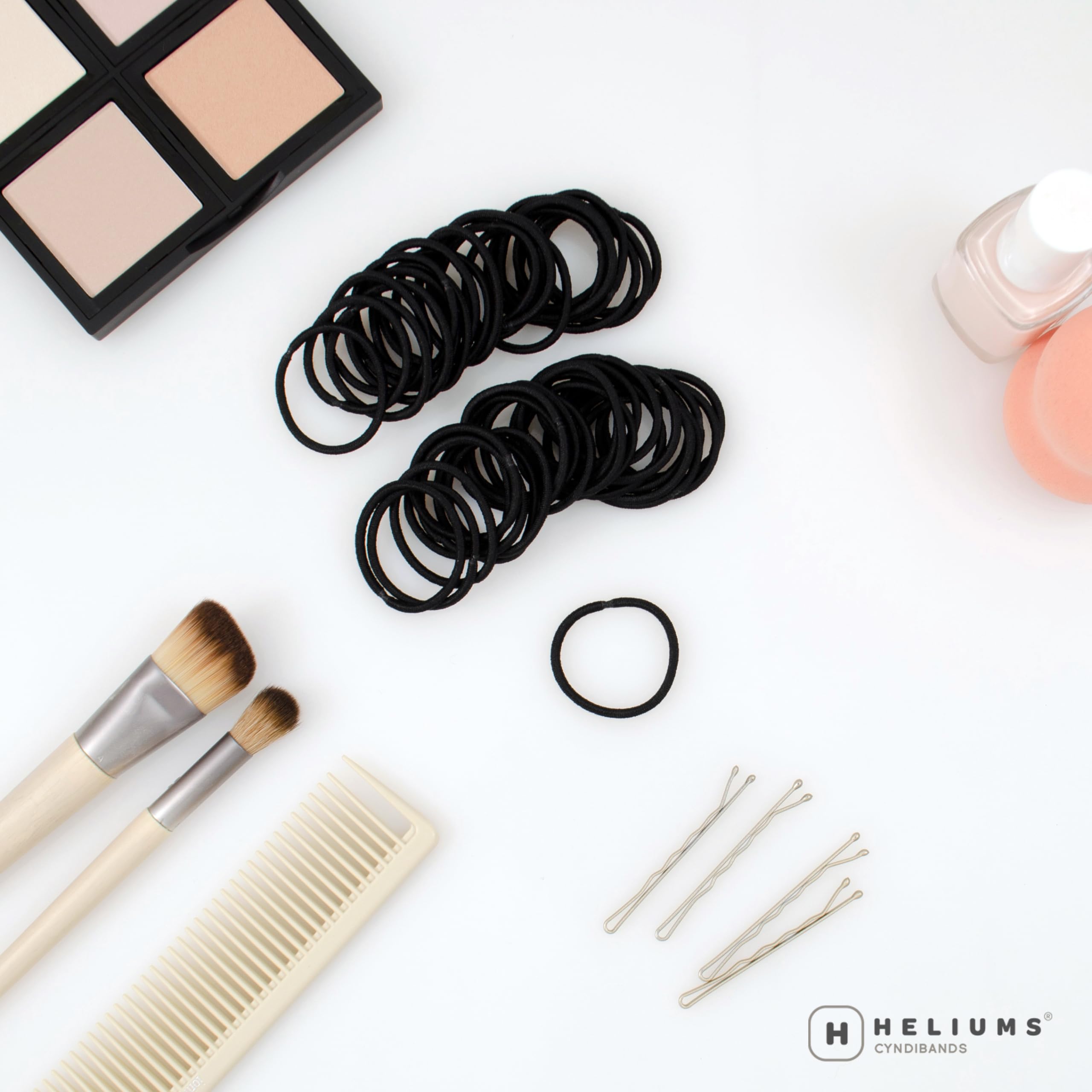 Heliums mini ponytail elastic in black keeps thin hair neatly in place