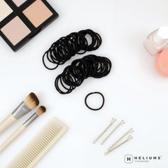 Heliums mini ponytail elastic in black keeps thin hair neatly in place