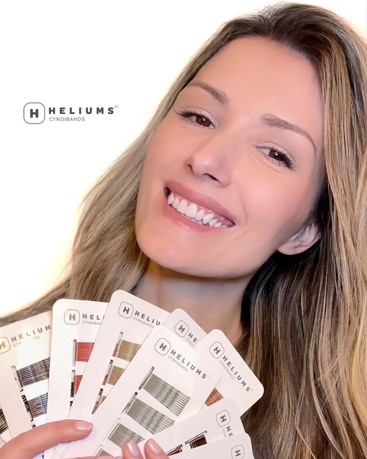 Pinzas Heliums con agarre antideslizante para peinados firmes.